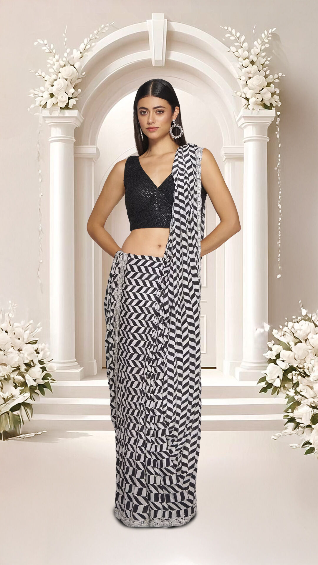 A woman flaunting a beautiful black designer saree